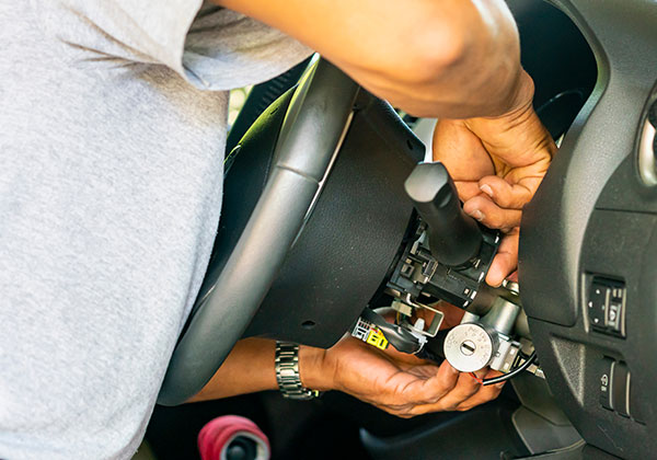 locksmith repairing an automotive ignition