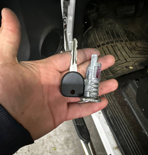 car door lock cylinder and a new key